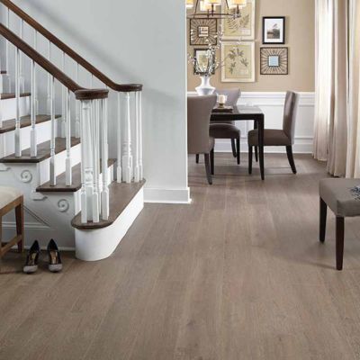 laminate flooring in a bright Modesto entrway and stairway